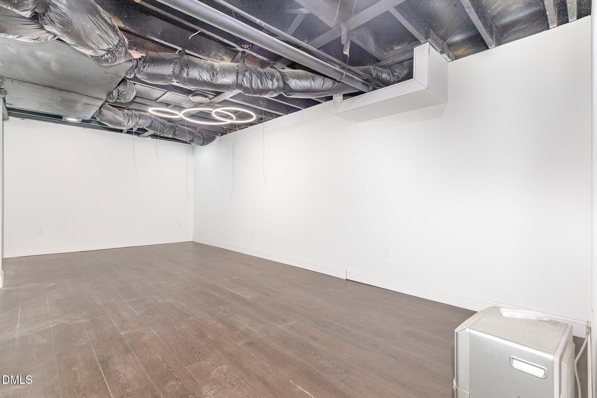 608 Dennis Avenue Raleigh, NC 27604 - Photo 23 of 30 a view of a room with racks on the wall