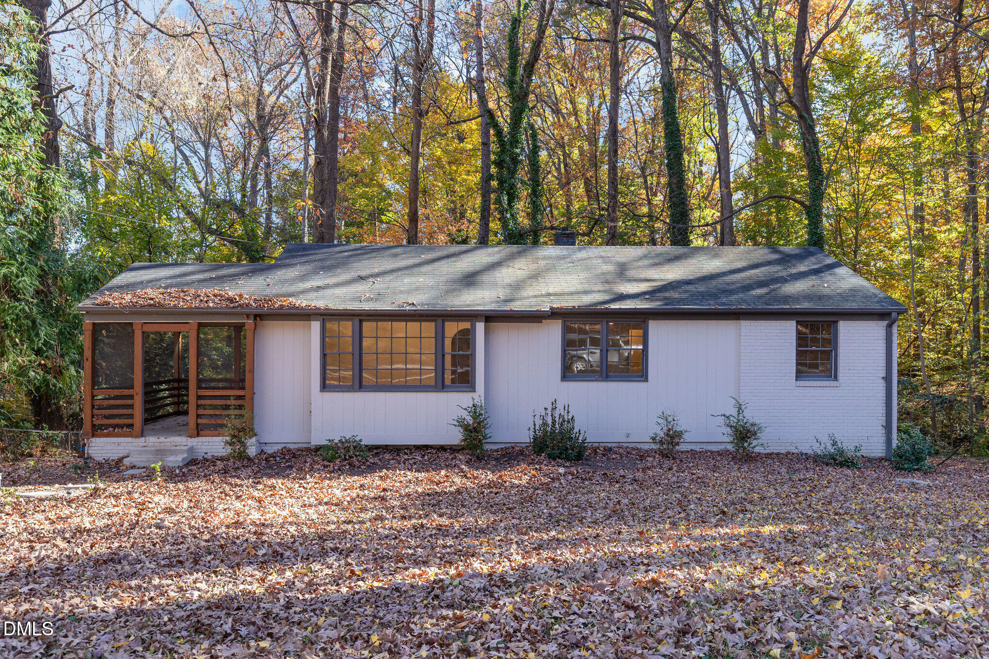 608 Dennis Avenue Raleigh, NC 27604 - Photo 4 of 30 a view of house with trees in the background
