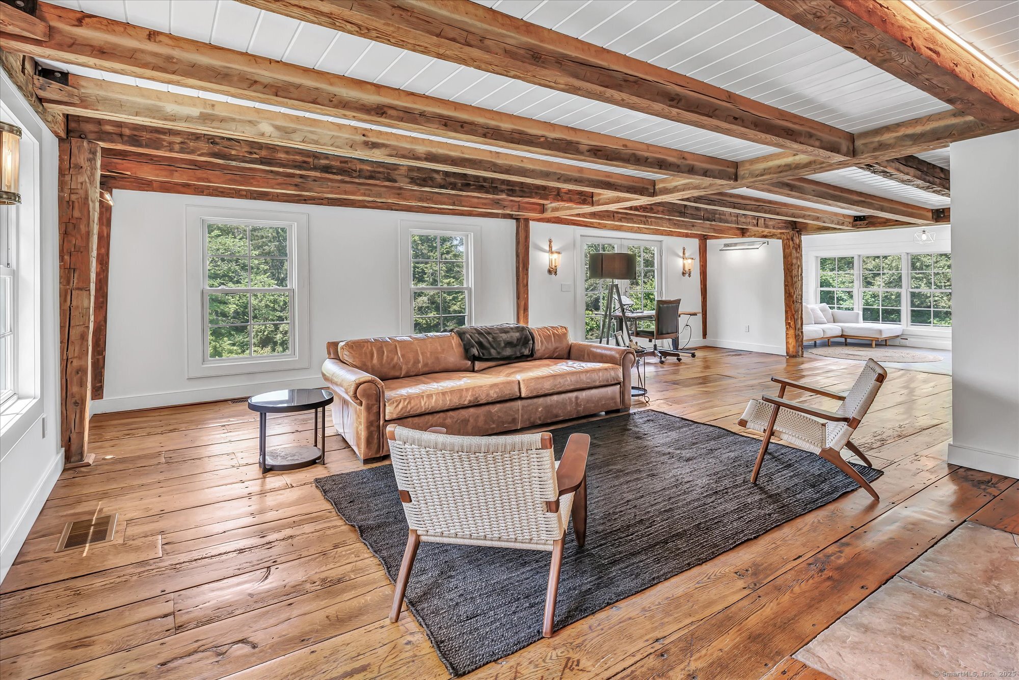 188 Wolf Neck Road Stonington, CT 06378 - Photo 11 of 40 a living room with furniture and a floor to ceiling window