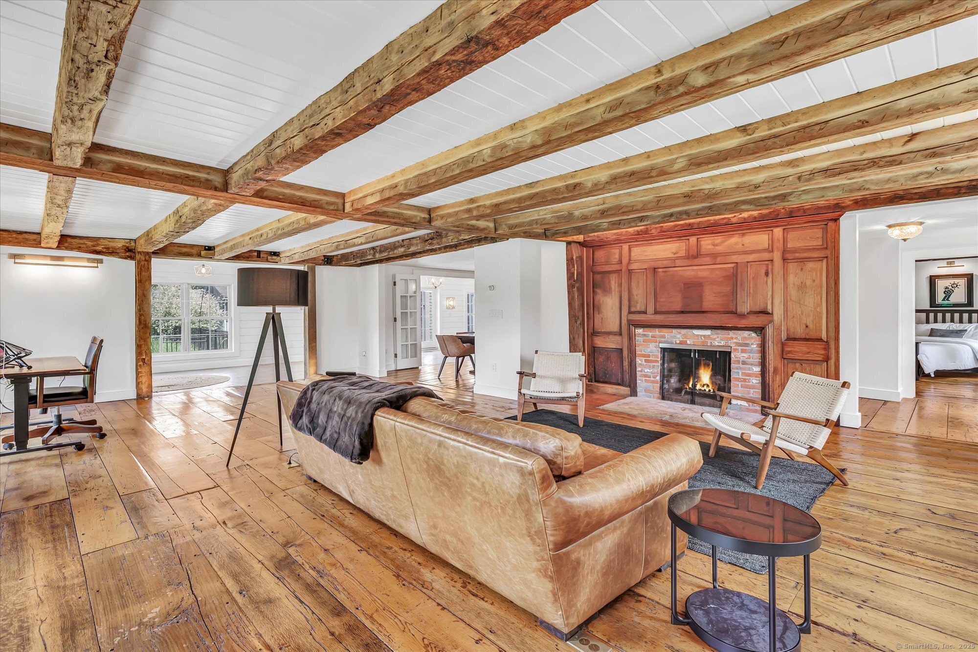 188 Wolf Neck Road Stonington, CT 06378 - Photo 12 of 40 a living room with furniture and a fireplace