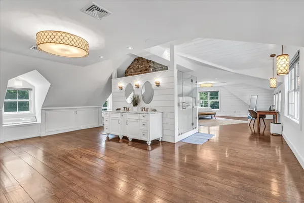 a view of dining room with furniture and wooden floor