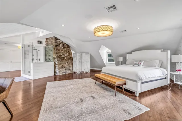 a bedroom with a bed and a couch