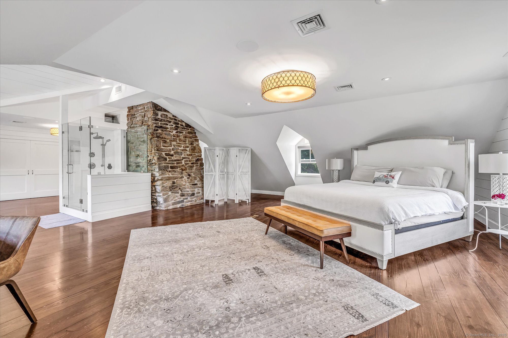 188 Wolf Neck Road Stonington, CT 06378 - Photo 31 of 40 a bedroom with a bed and a couch