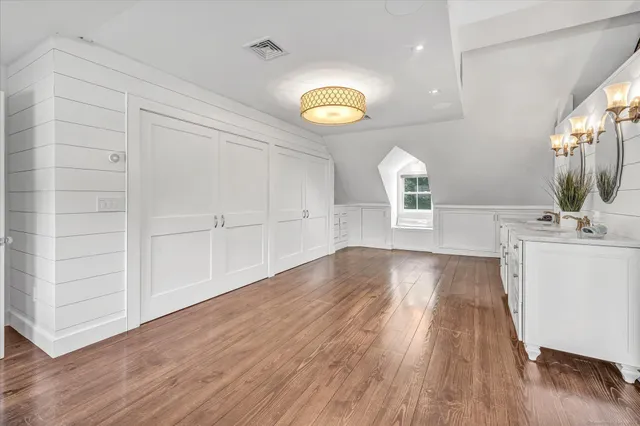 a view of a kitchen cabinets and a wooden floor