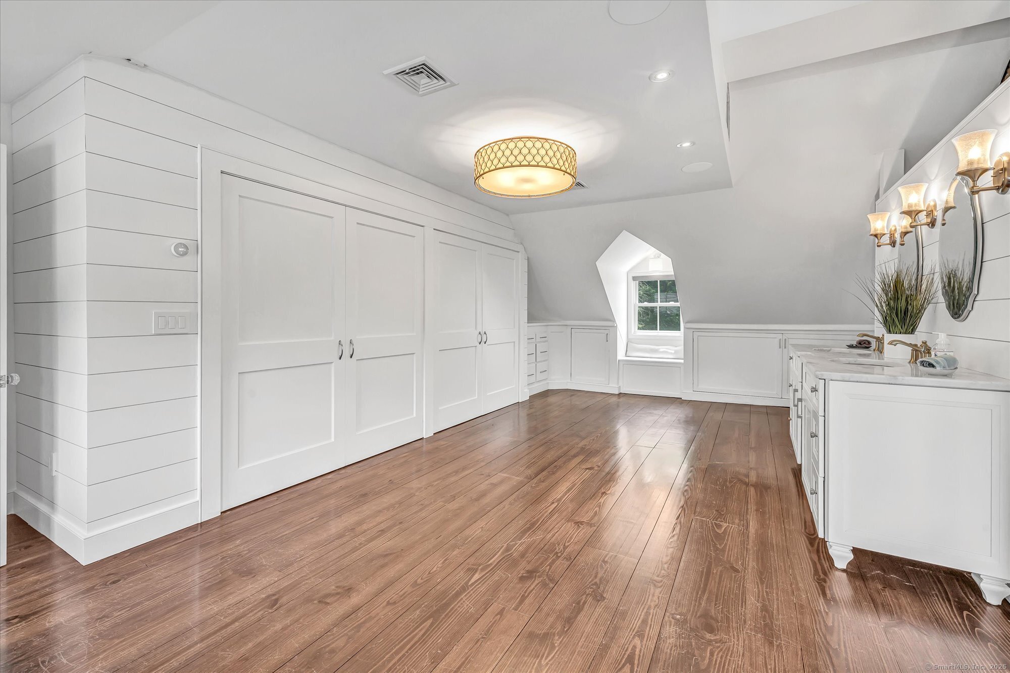 188 Wolf Neck Road Stonington, CT 06378 - Photo 35 of 40 a view of a kitchen cabinets and a wooden floor