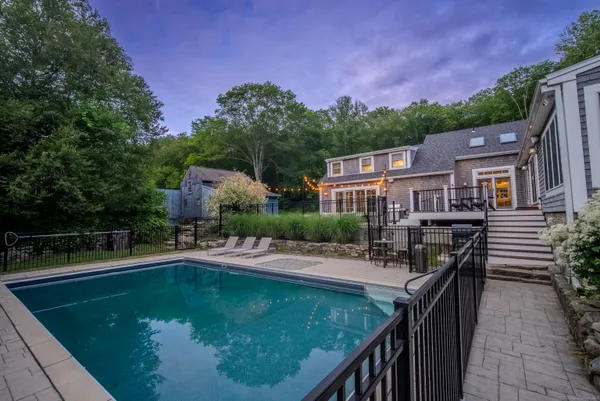 a view of a swimming pool with a patio