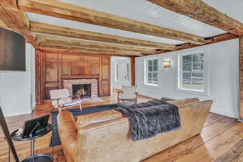 a spacious bedroom with a bed and a fireplace