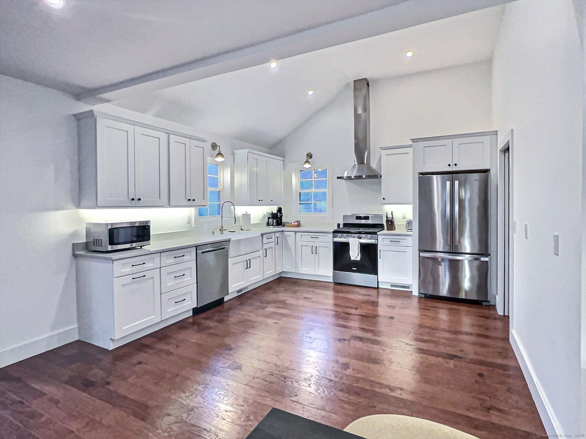 188 Wolf Neck Road Stonington, CT 06378 - Photo 39 of 40 a kitchen with a refrigerator cabinets and wooden floor