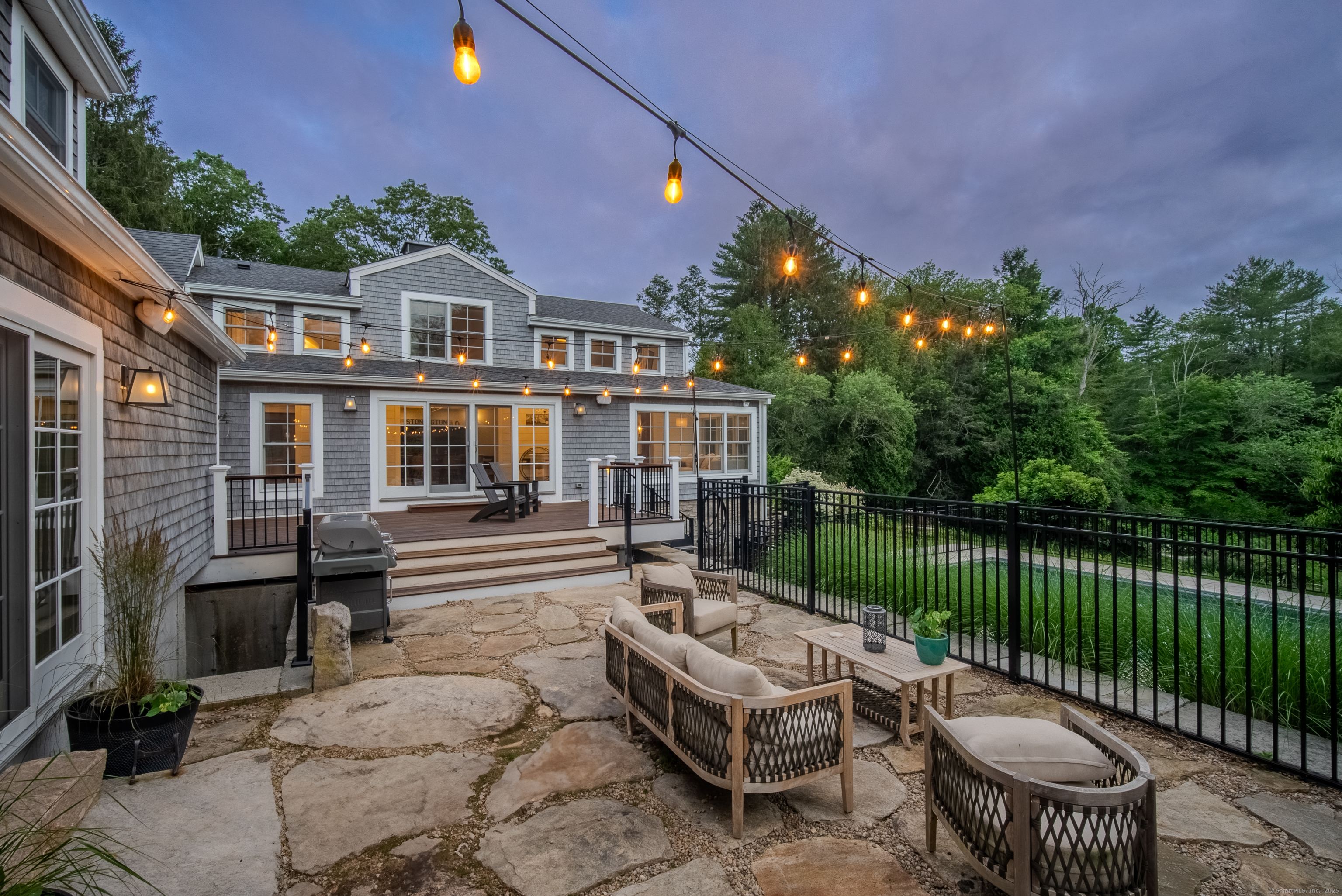 188 Wolf Neck Road Stonington, CT 06378 - Photo 5 of 40 a view of a patio with couches table and chairs and potted plants