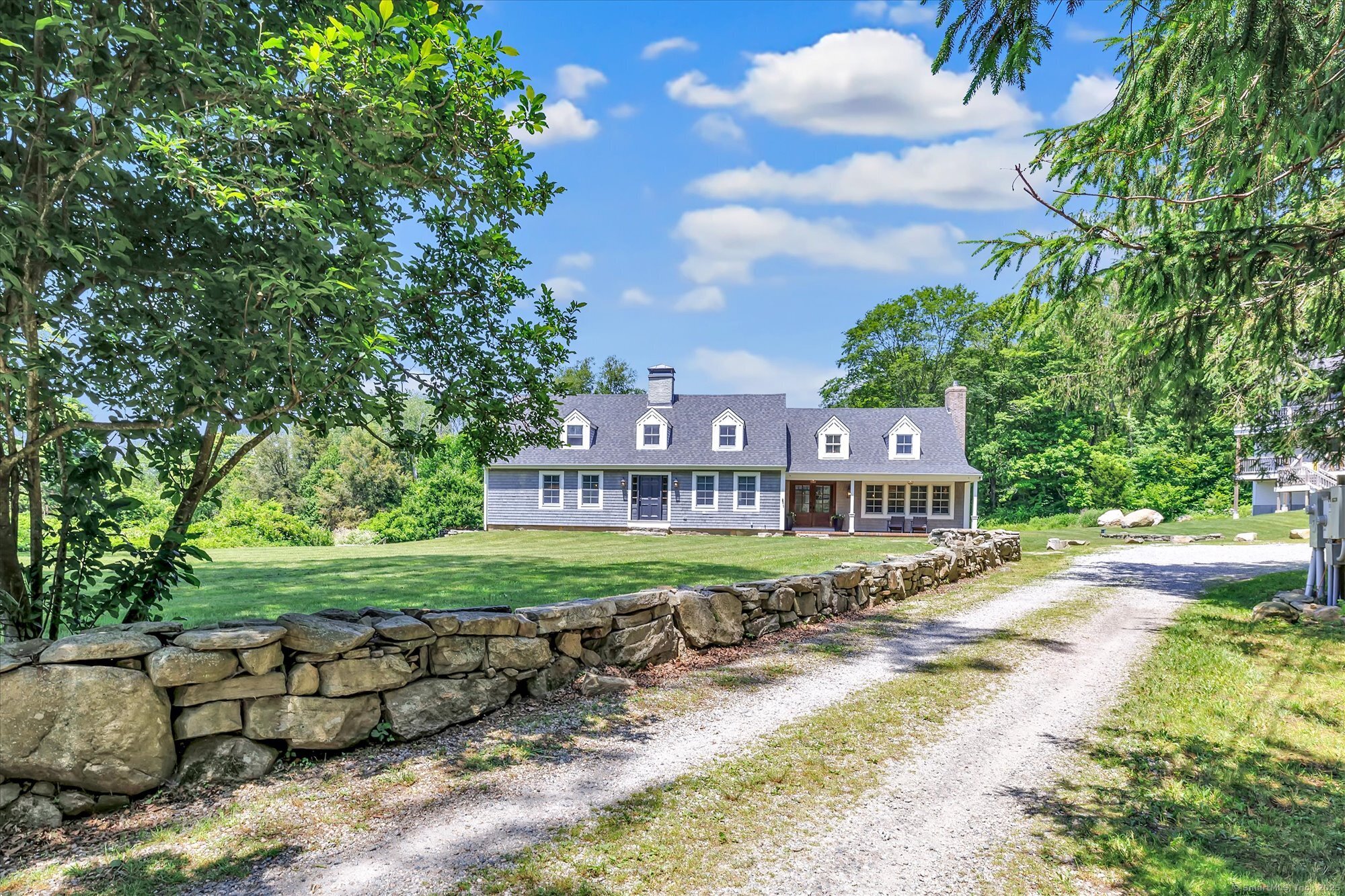 188 Wolf Neck Road Stonington, CT 06378 - Photo 6 of 40 a front view of a house with a yard