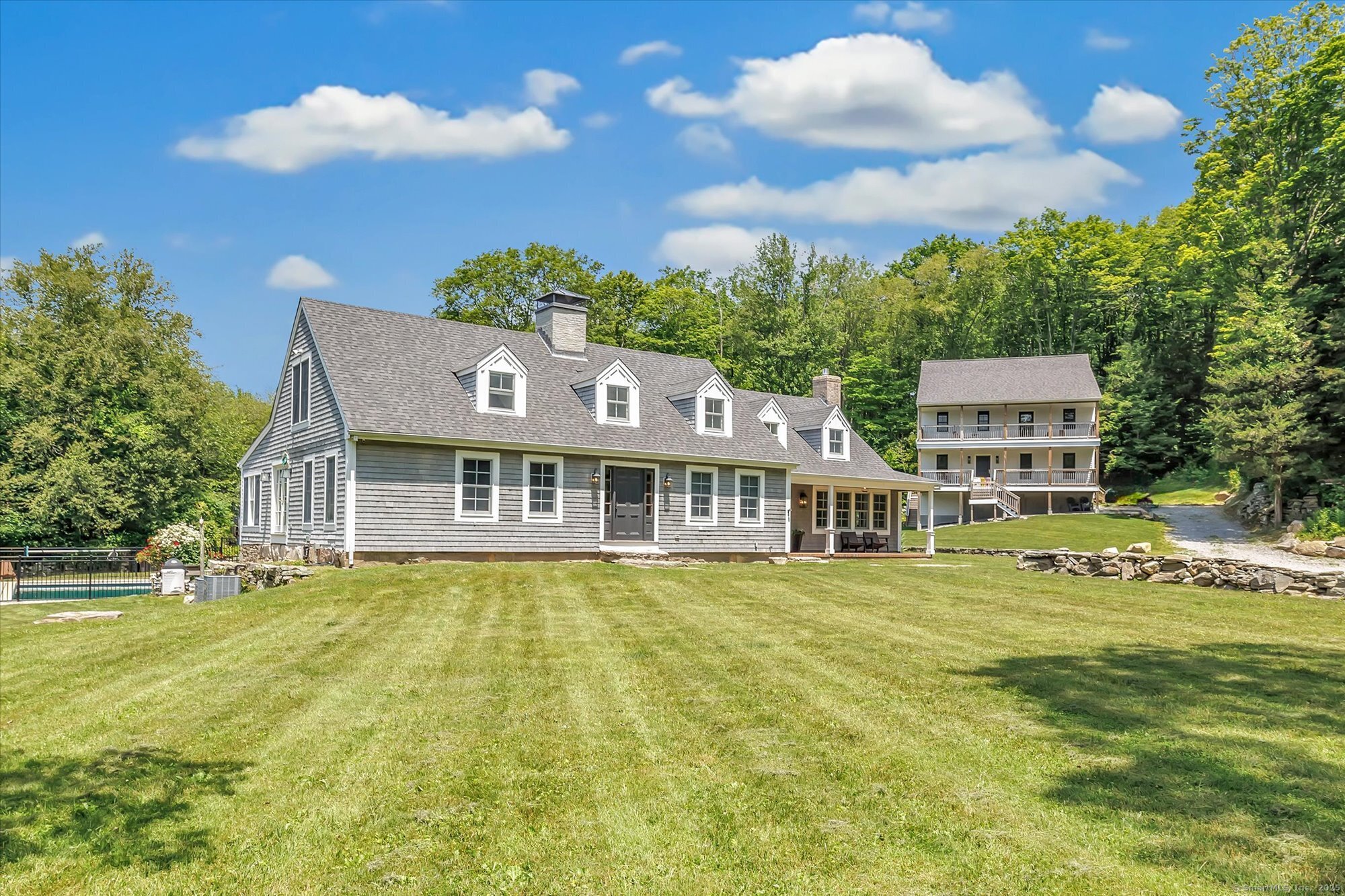 188 Wolf Neck Road Stonington, CT 06378 - Photo 7 of 40 a front view of a house with a garden