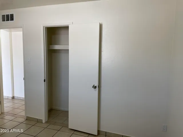 a view of small space with racks on the wall