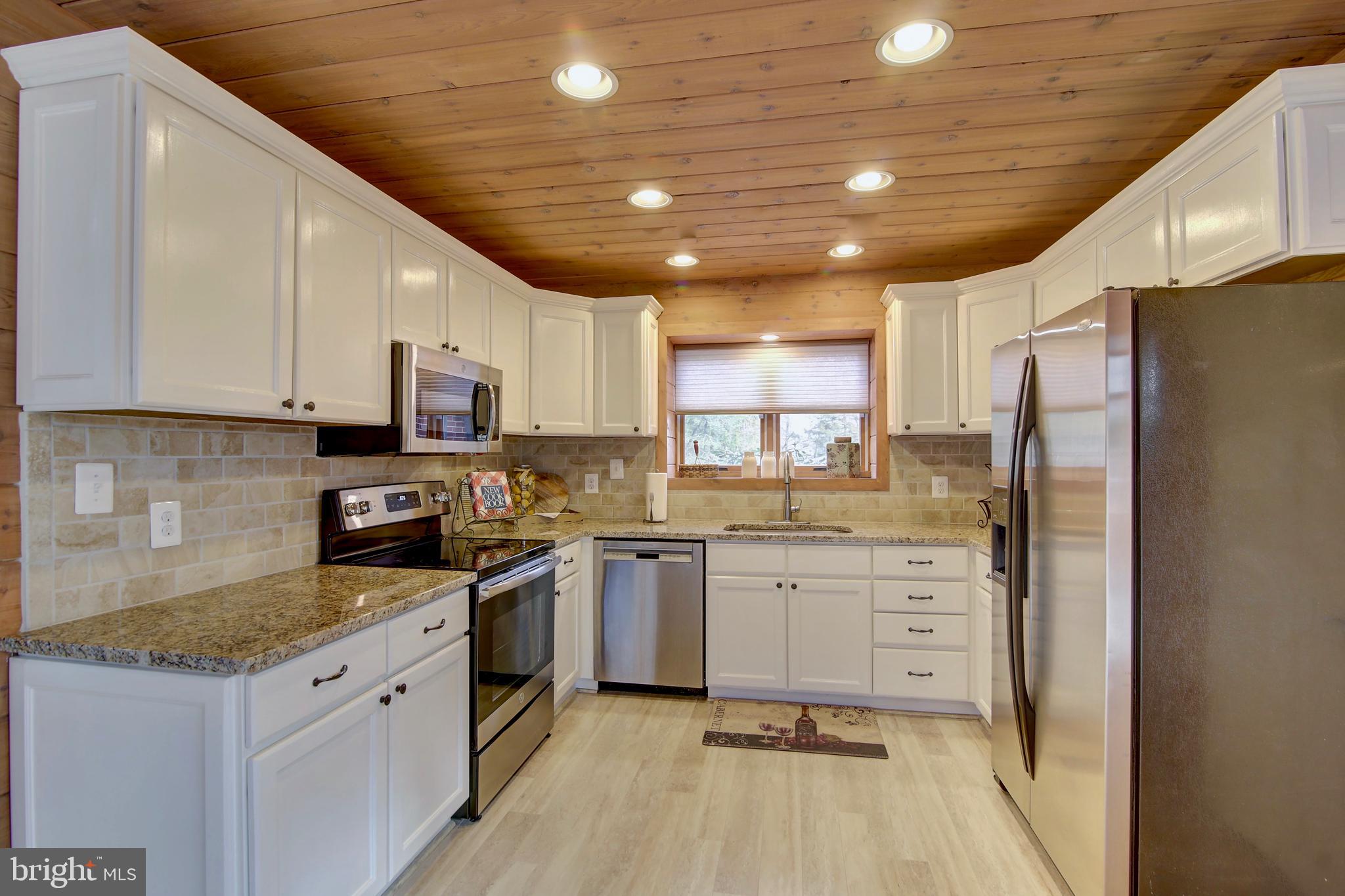 19990 Gleedsville Road Leesburg, VA 20175 - Photo 6 of 53 Raised freshly painted white cabinets & new floor.