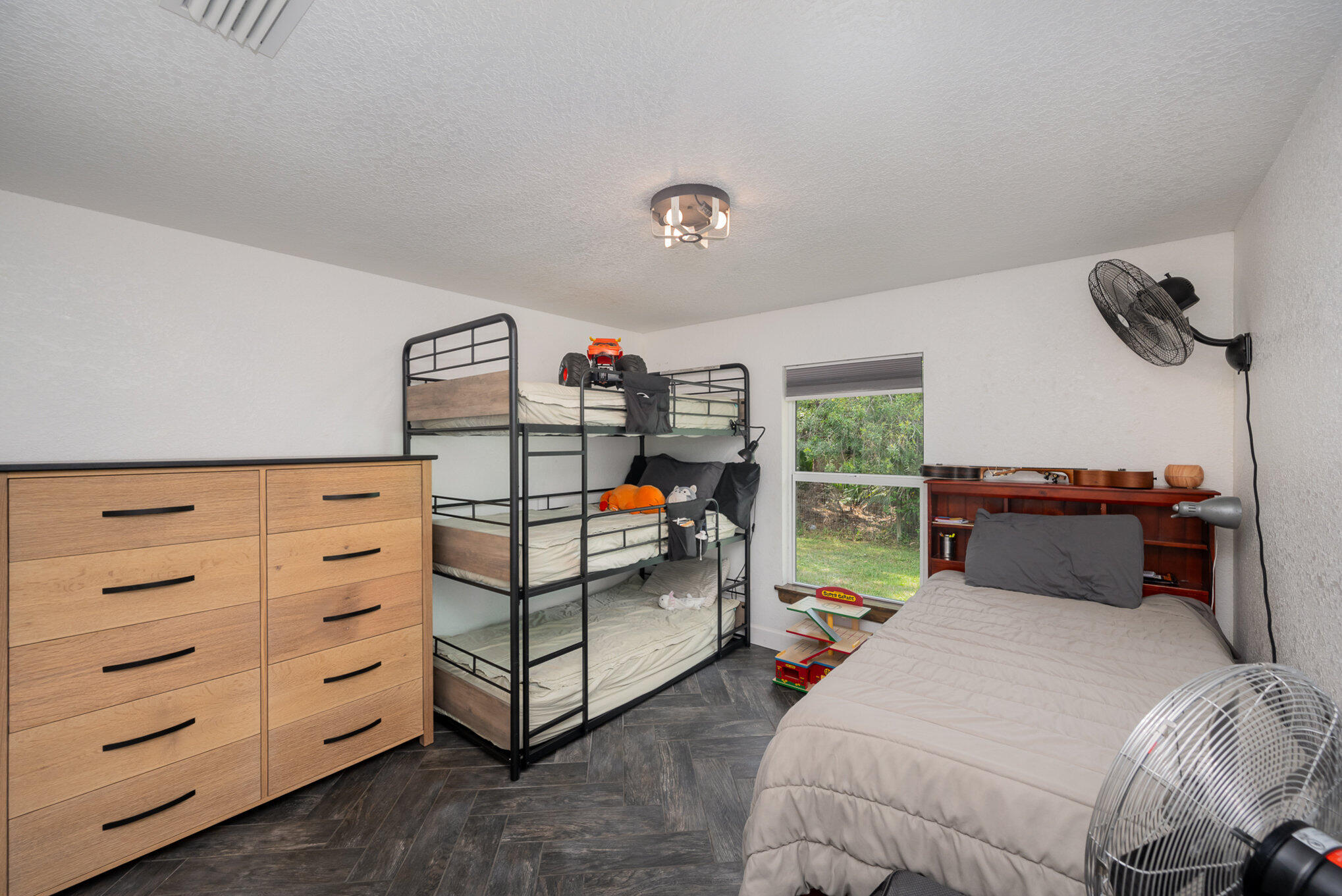 3650 Corey Road Malabar, FL 32950 - Photo 21 of 40 a bedroom with furniture and a window