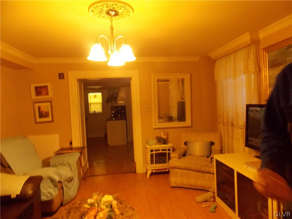 86 Broadway Jim Thorpe, PA 18229 - Photo 6 of 17 a bedroom with a bed and wooden floor