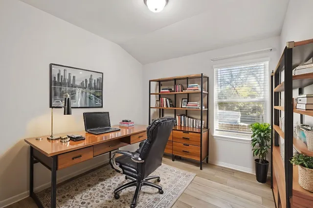 a workspace with furniture and a window