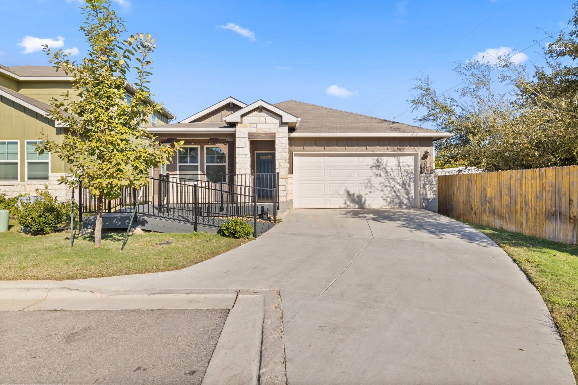 700 Autumn Stem Place Austin, TX 78748 - Photo 2 of 36 a front view of a house with garden