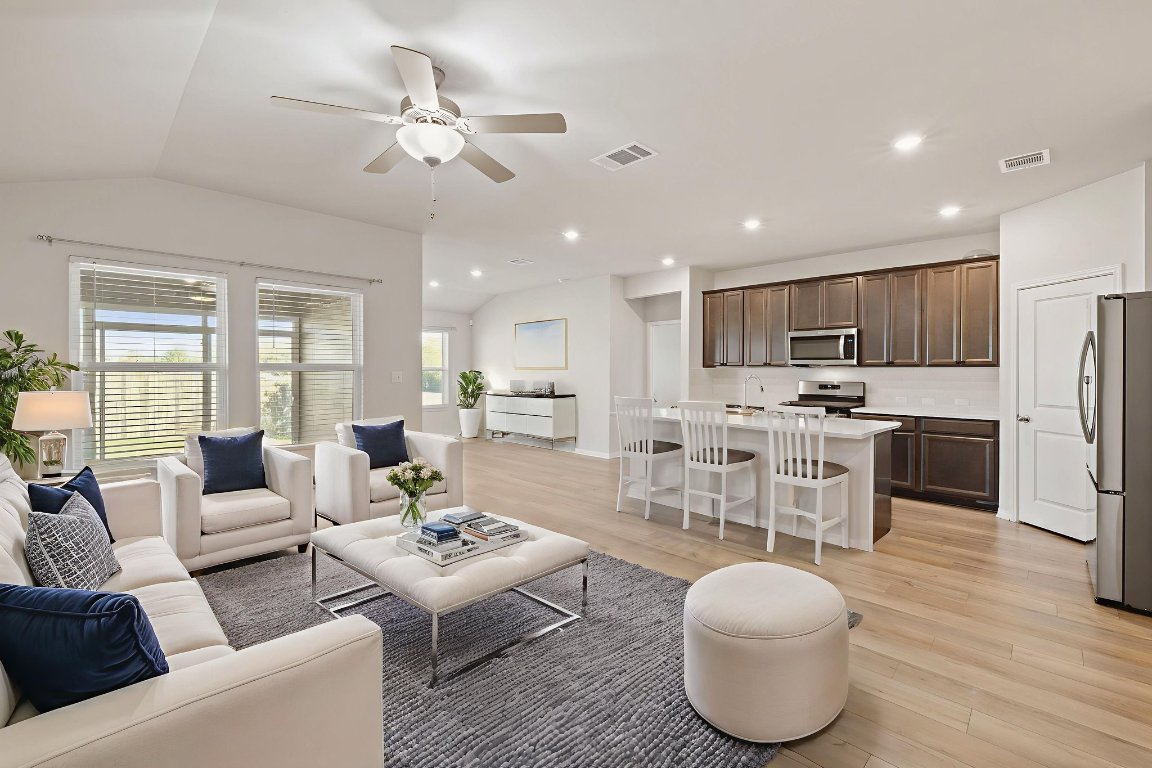 700 Autumn Stem Place Austin, TX 78748 - Photo 20 of 36 a living room with furniture and kitchen view
