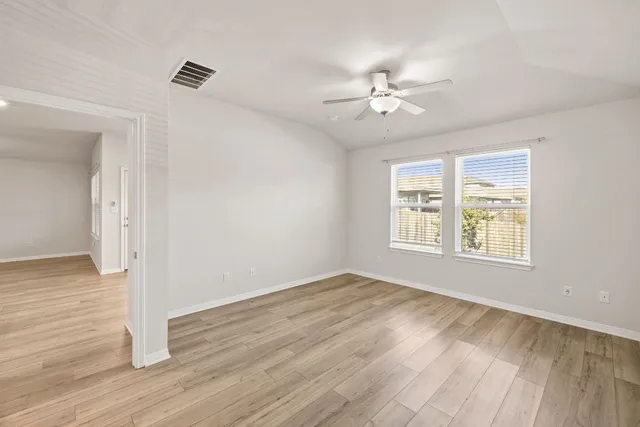 a view of a dining room with furniture and window