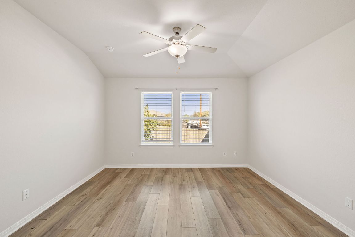 700 Autumn Stem Place Austin, TX 78748 - Photo 27 of 36 wooden floor in an empty room with a window