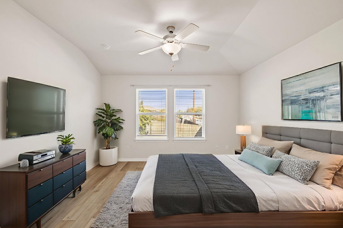 700 Autumn Stem Place Austin, TX 78748 - Photo 28 of 36 a bedroom with a bed and a flat screen tv