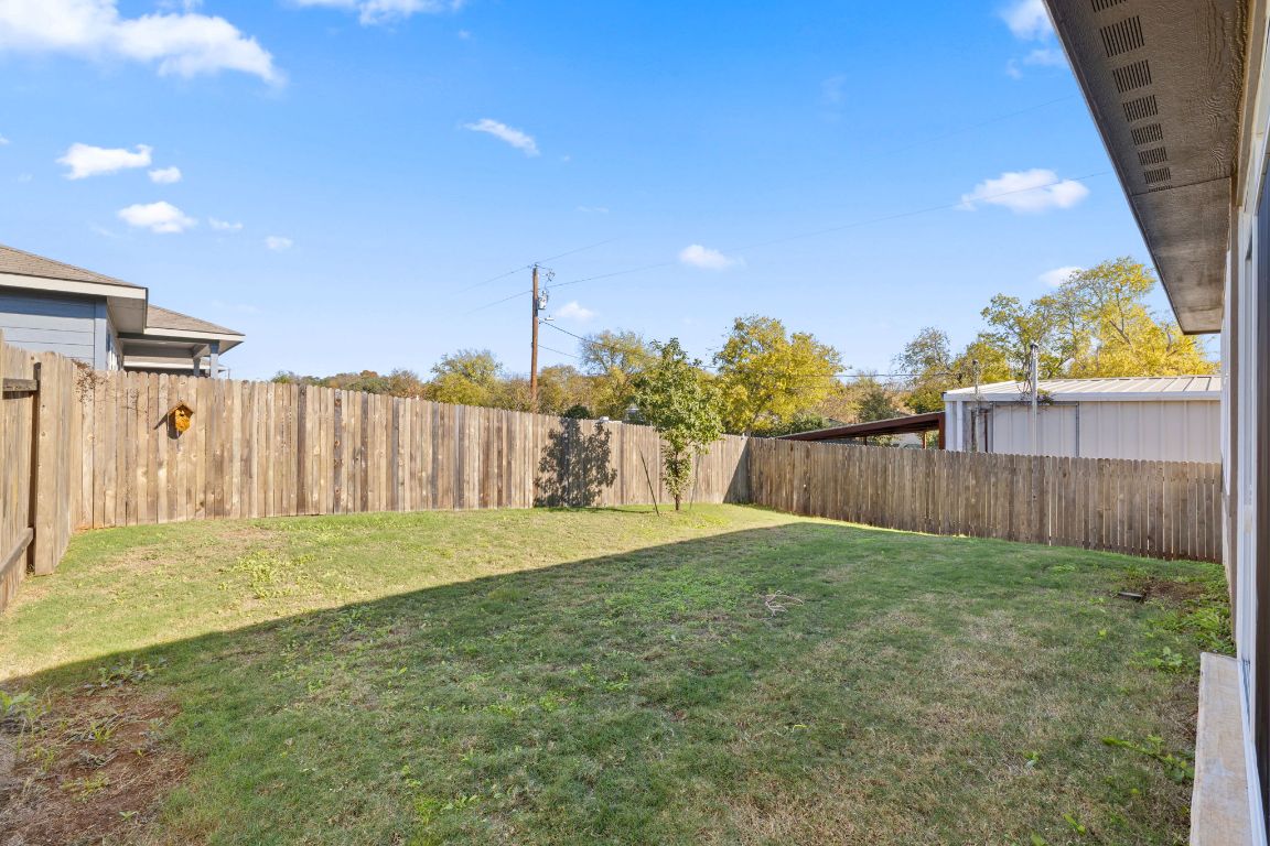 700 Autumn Stem Place Austin, TX 78748 - Photo 34 of 36 a view of backyard with wooden fence