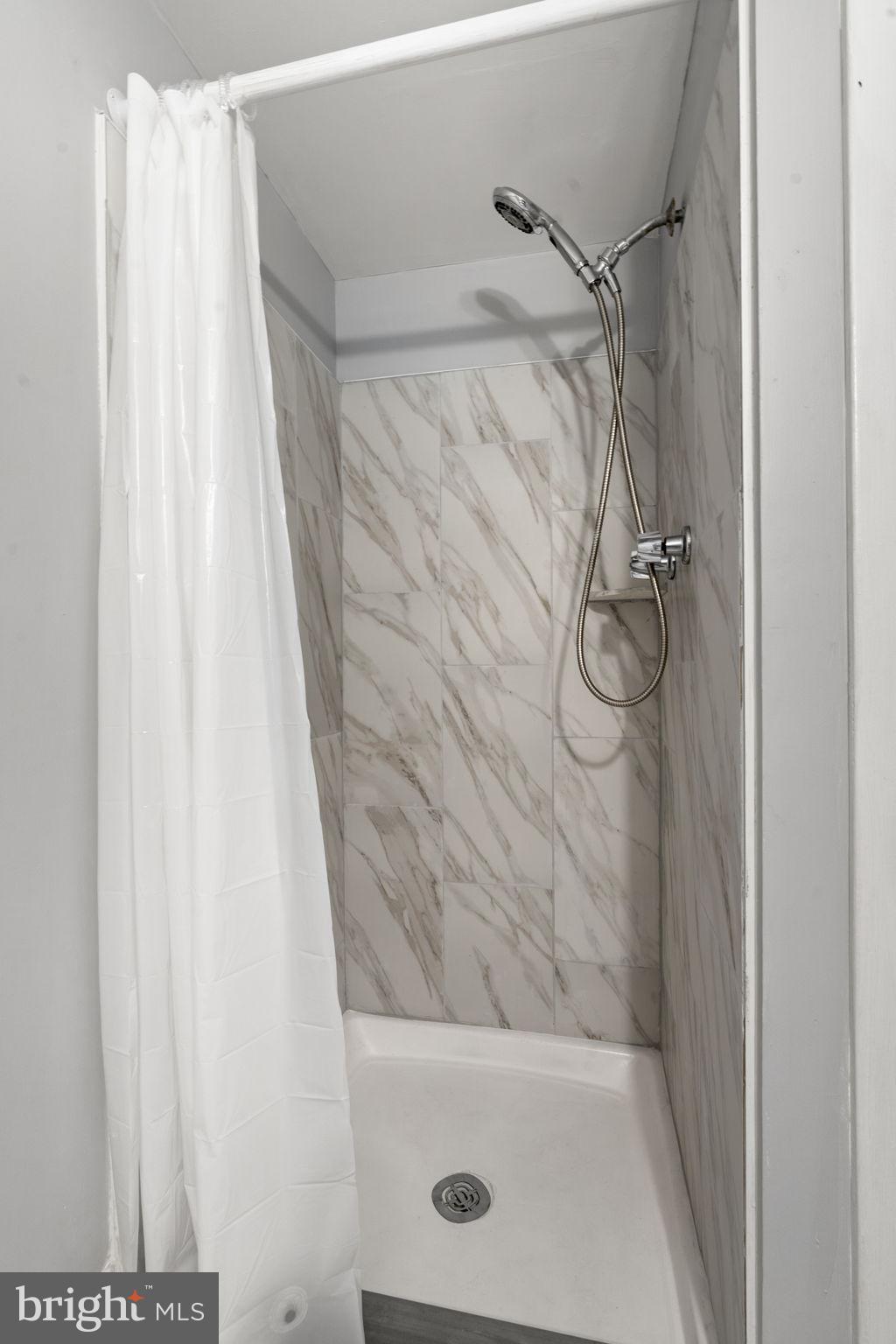 814 South Avenue, Unit J6 Secane, PA 19018 - Photo 12 of 15 a bathroom with a shower