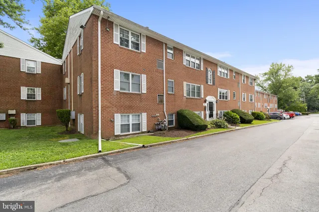 a front view of a building with garden