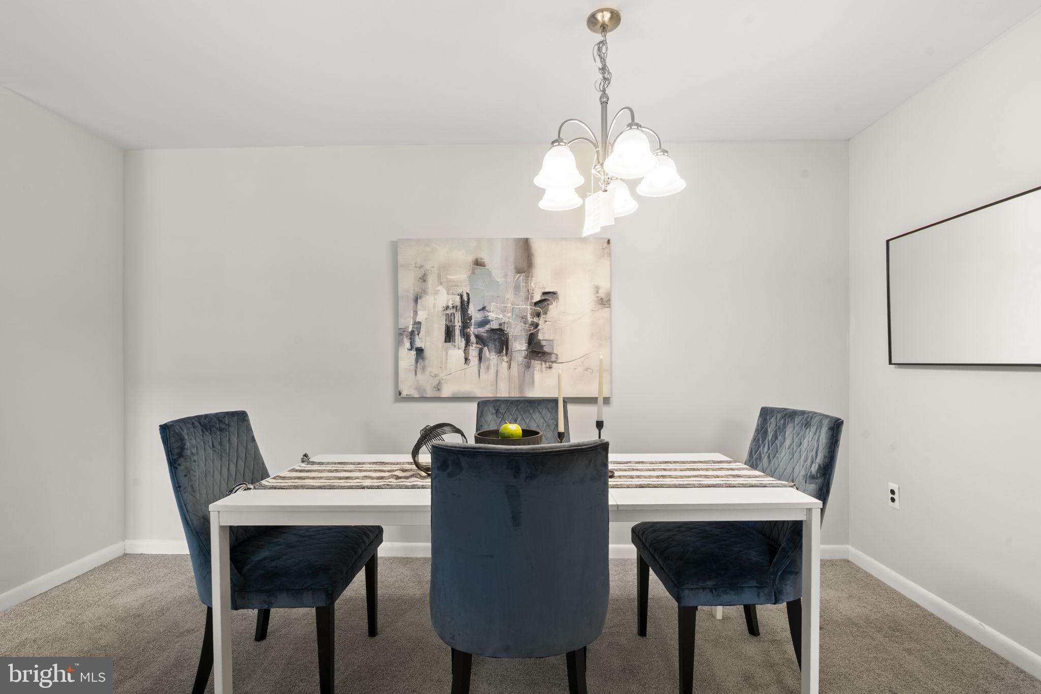 814 South Avenue, Unit J6 Secane, PA 19018 - Photo 3 of 15 a view of a dining room with furniture and chandelier