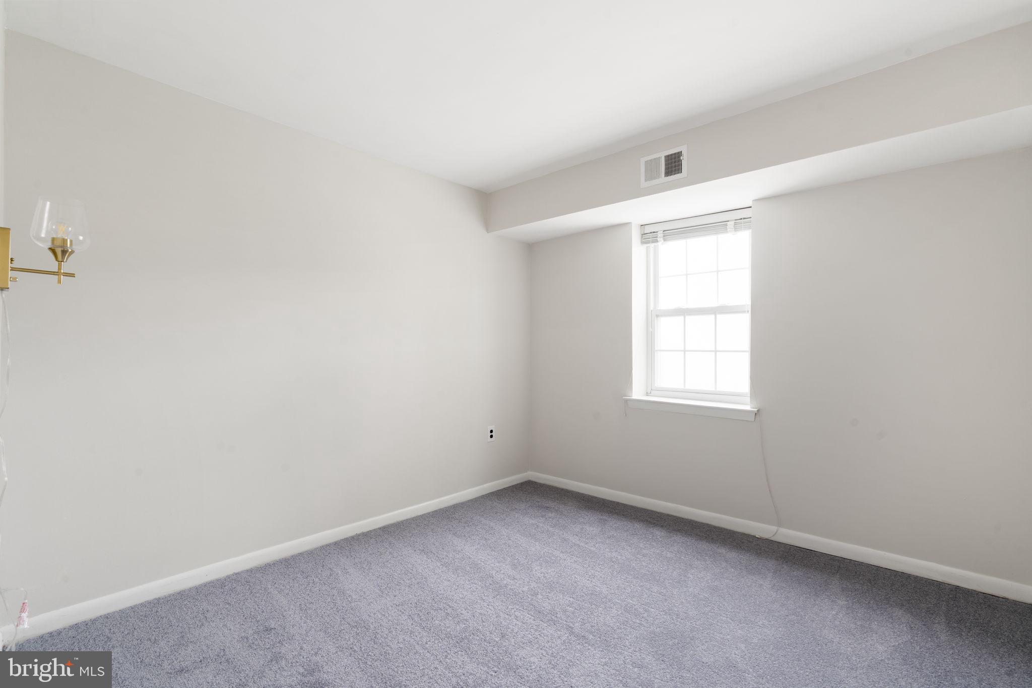 814 South Avenue, Unit J6 Secane, PA 19018 - Photo 6 of 15 an empty room with a window