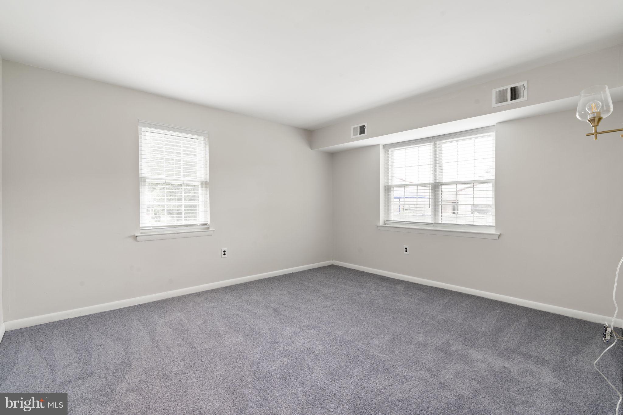 814 South Avenue, Unit J6 Secane, PA 19018 - Photo 10 of 15 an empty room with windows