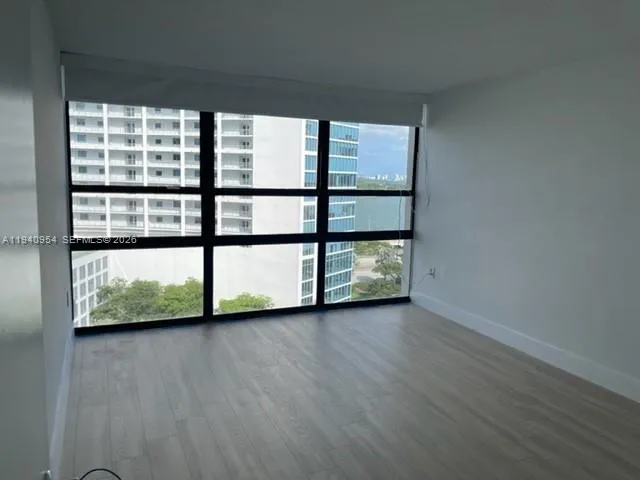 a view of a large window with wooden floor
