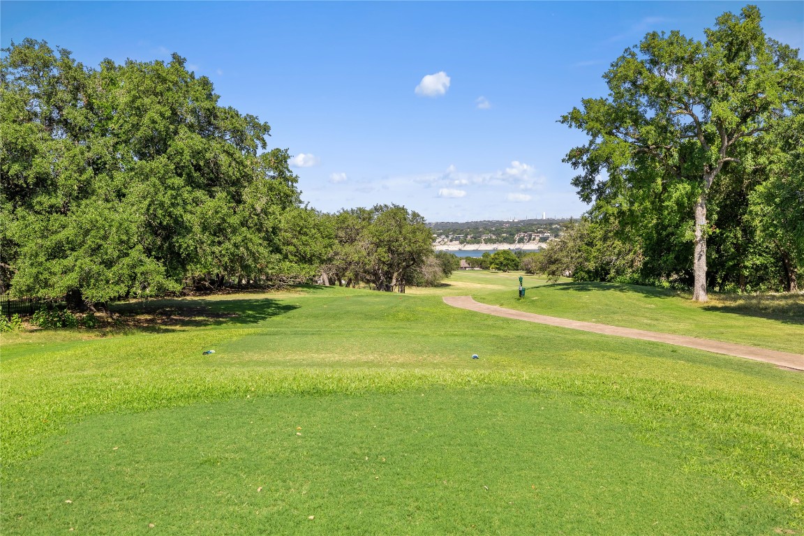 160 Lakefront Drive Point Venture, TX 78645 - Photo 12 of 21 a view of a house with a big yard and large trees