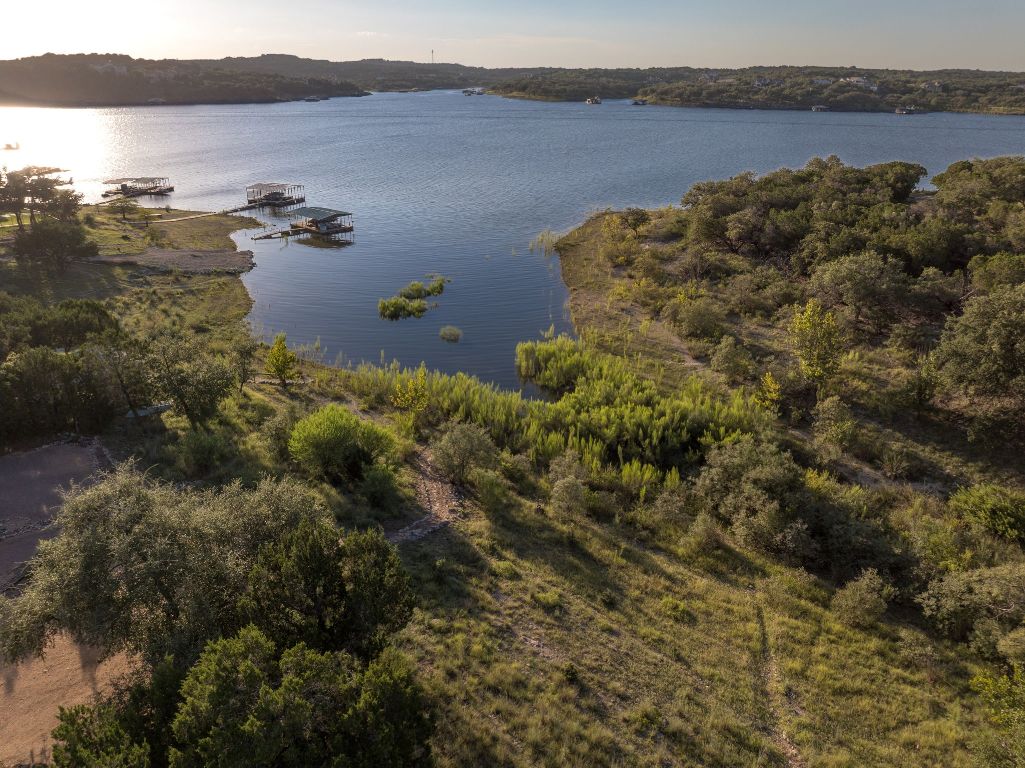 160 Lakefront Drive Point Venture, TX 78645 - Photo 2 of 21 an aerial view of house with yard and ocean view