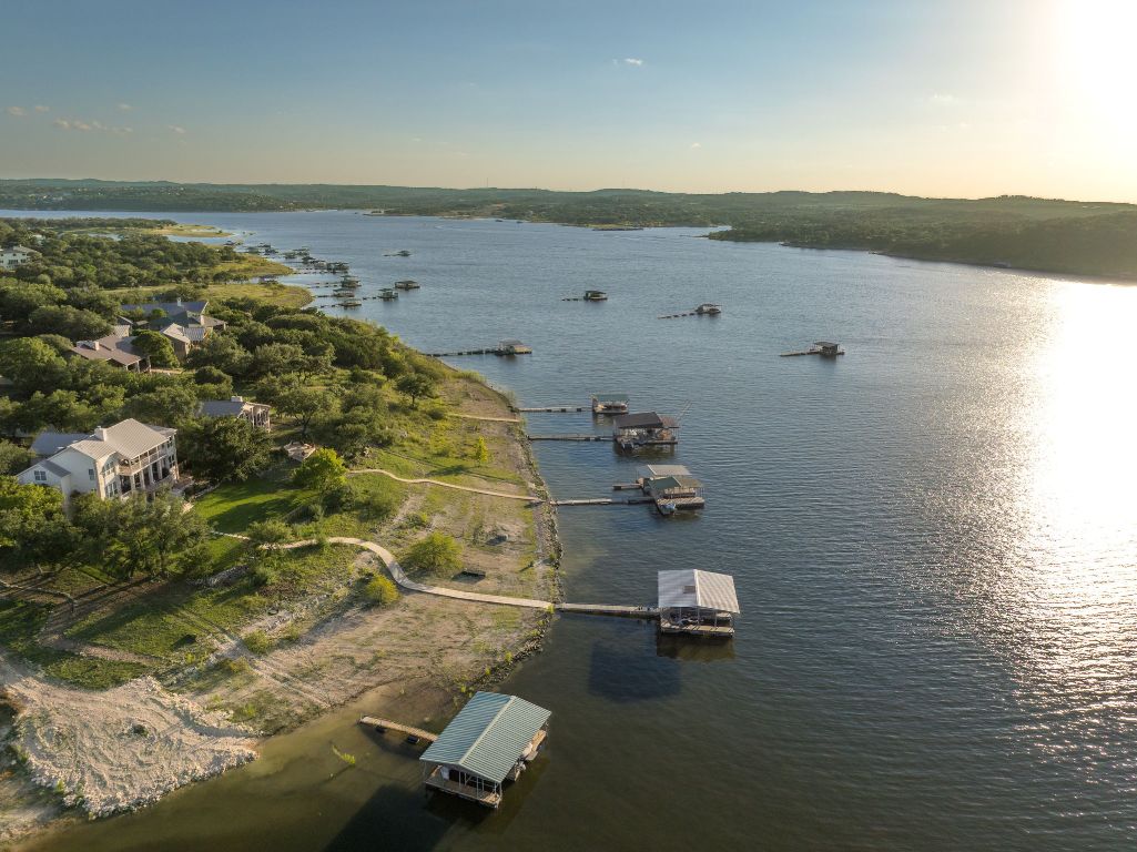 160 Lakefront Drive Point Venture, TX 78645 - Photo 9 of 21 an aerial view of a house with a lake view