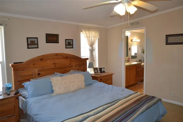 a bath tub sitting next to a bathroom sink and a mirror