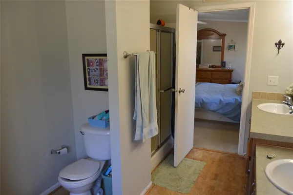 a en suite bathroom with a sink double vanity and a mirror