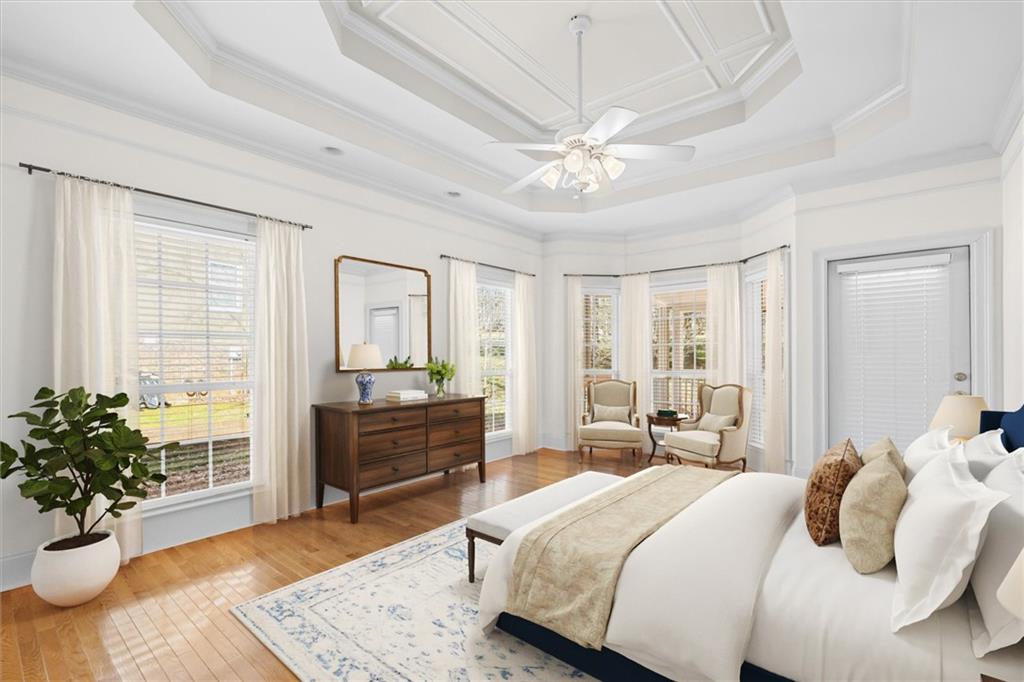 1030 Lakeview Parkway Villa Rica, GA 30180 - Photo 12 of 46 a bedroom with a balcony a bed and a chandelier