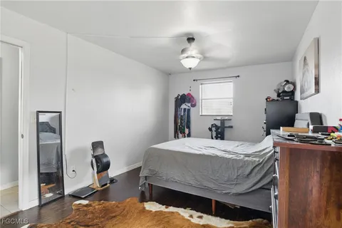 a bed room with a bed and a desk