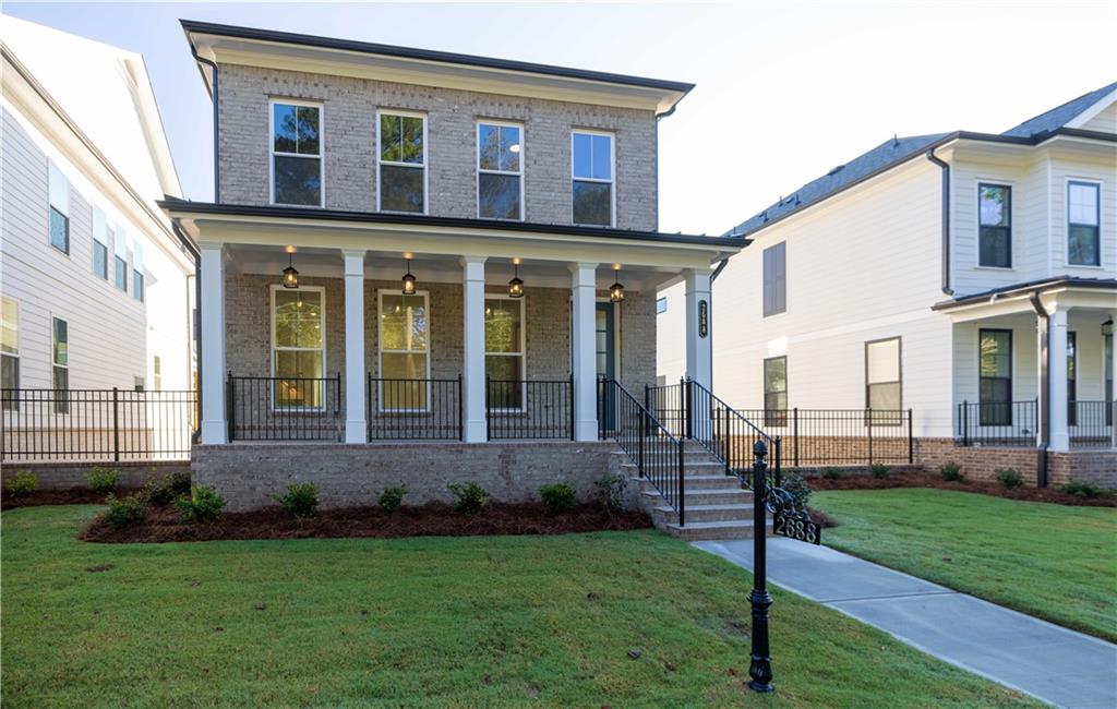 157 Basil Street Cumming, GA 30040 - Photo 1 of 1 a front view of a house with a yard