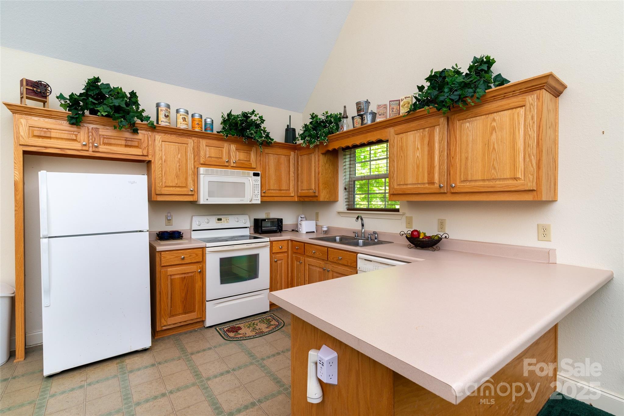 419 Bayberry Cove Road Sylva, NC 28779 - Photo 3 of 12 a kitchen with a sink a stove and cabinets