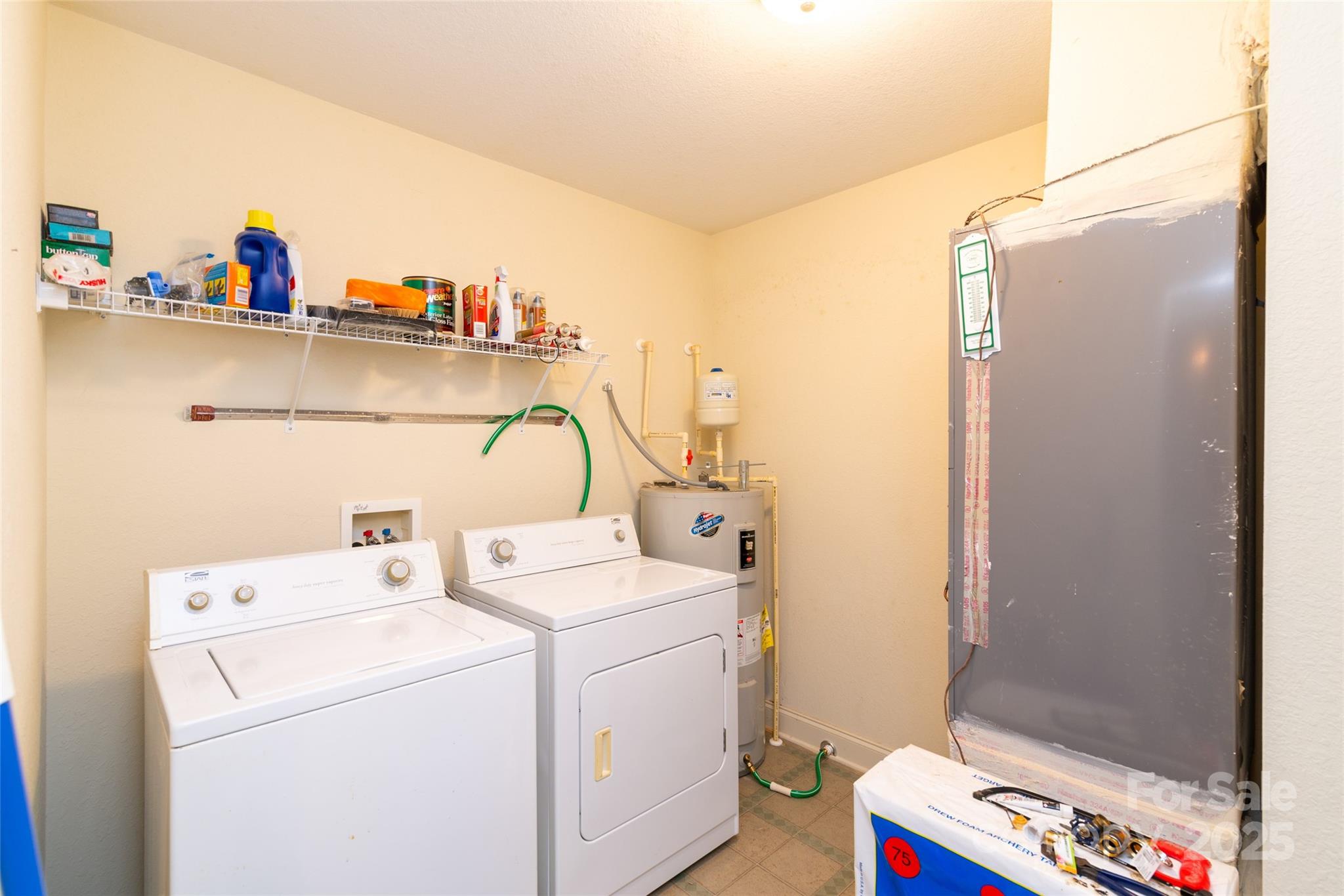 419 Bayberry Cove Road Sylva, NC 28779 - Photo 6 of 12 a utility room with dryer and washer