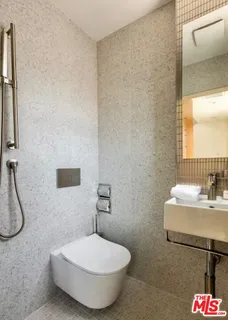 a bathroom with a double vanity sink and mirror