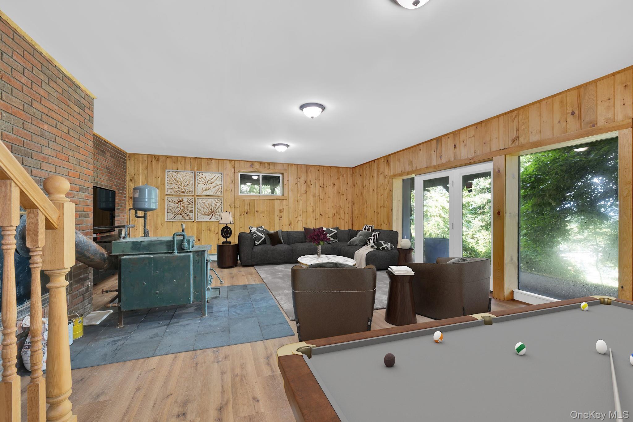 53 West Corbett Road Montgomery, NY 12549 - Photo 23 of 41 a living room with furniture large windows and wooden floor