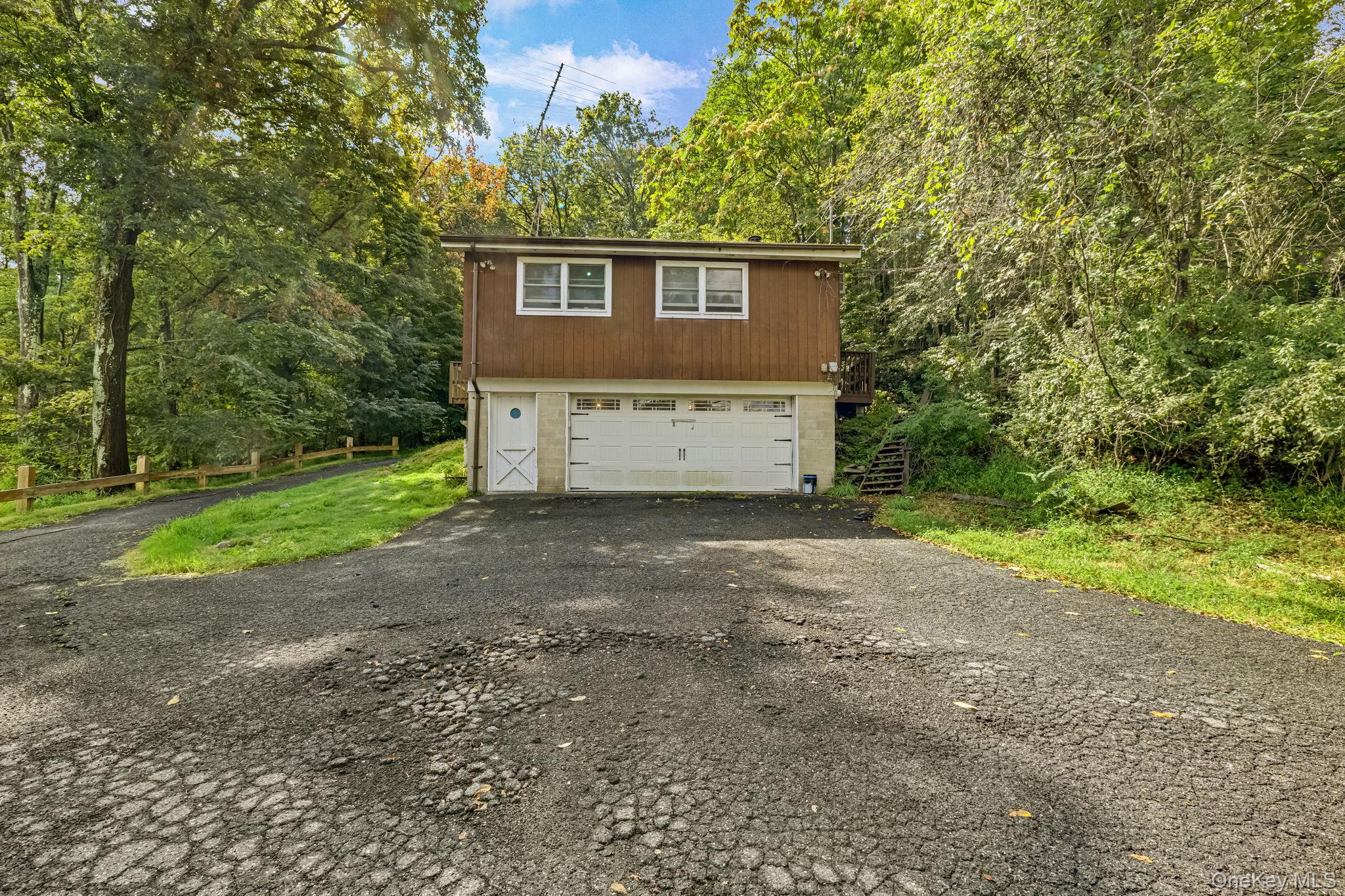 53 West Corbett Road Montgomery, NY 12549 - Photo 37 of 41 a front view of a house with a yard and garage
