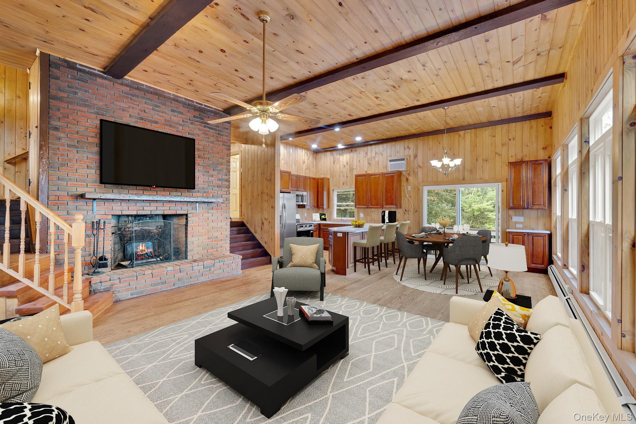 53 West Corbett Road Montgomery, NY 12549 - Photo 4 of 41 a living room with furniture a flat screen tv and a fireplace