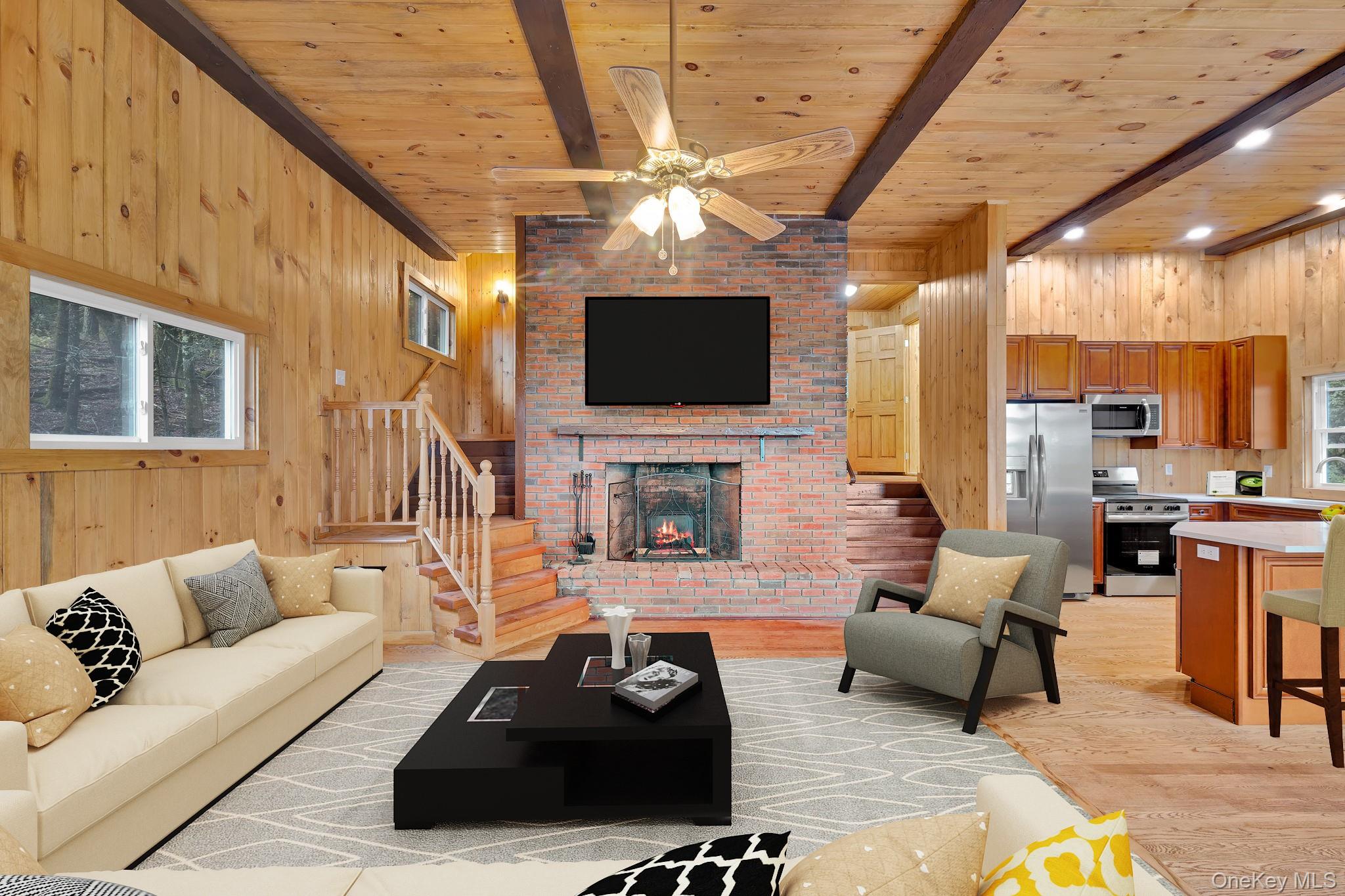 53 West Corbett Road Montgomery, NY 12549 - Photo 5 of 41 a living room with furniture a fireplace and a flat screen tv