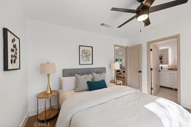 a bathroom with double sink and a mirror