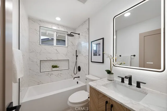 a view of a patio with a dining table and chairs with wooden floor