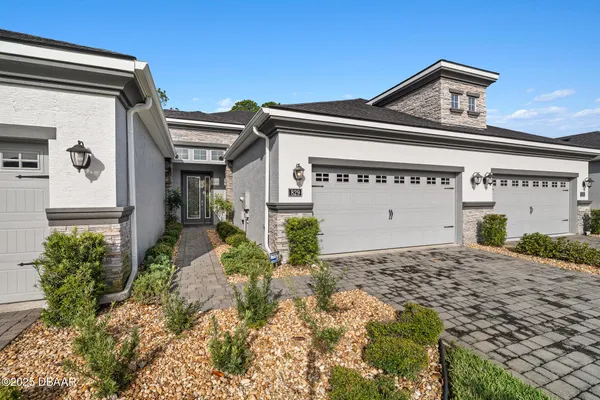 a view of a house with a garage